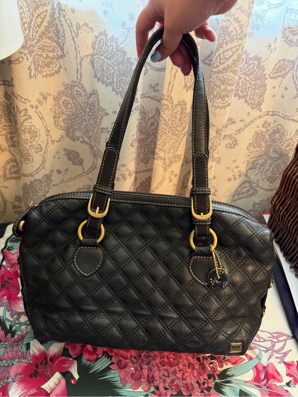 The Sak Black Quilted Shoulder Bag with Gold Accents